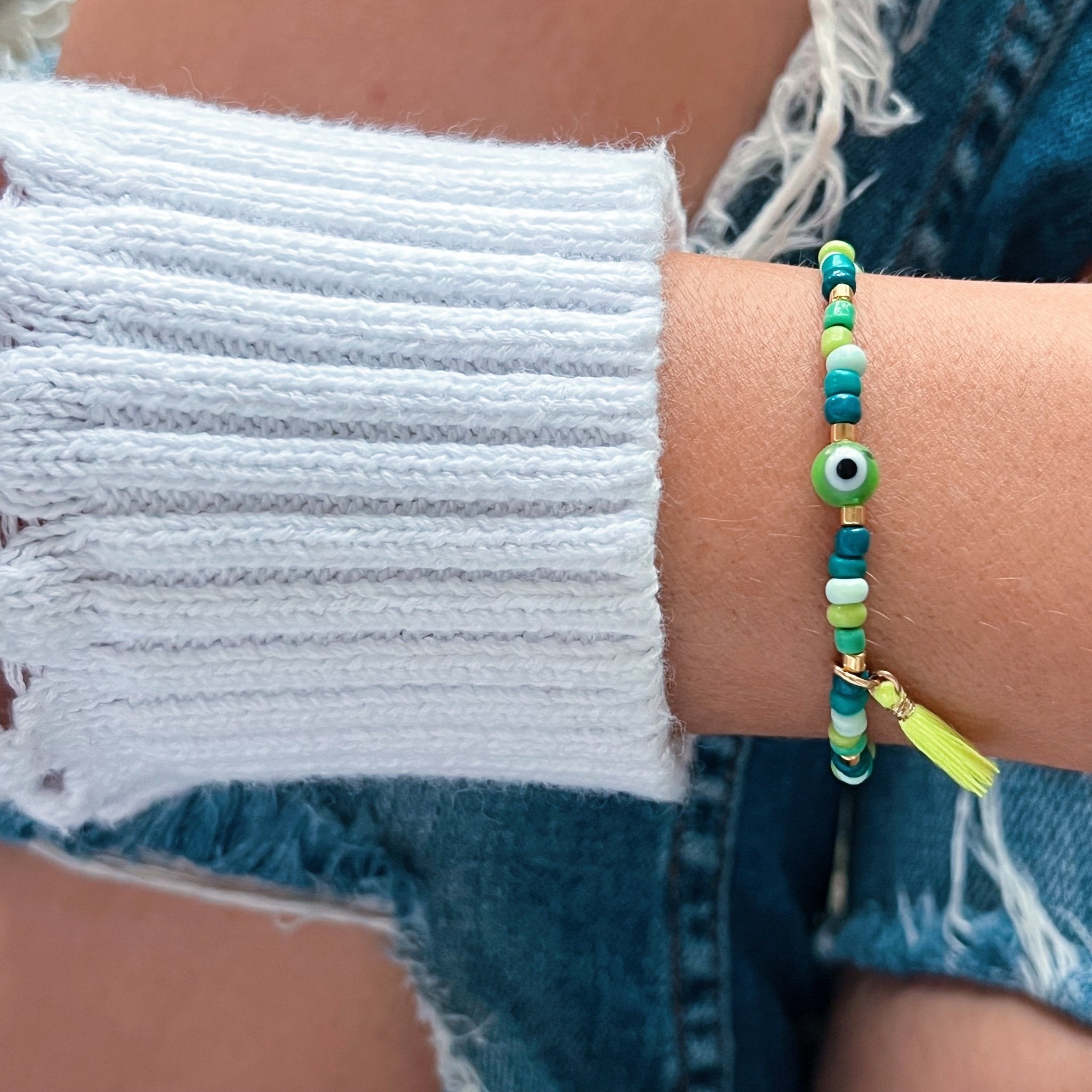 I carry balance and healing energy — Green Evil Eye Beaded Bracelet